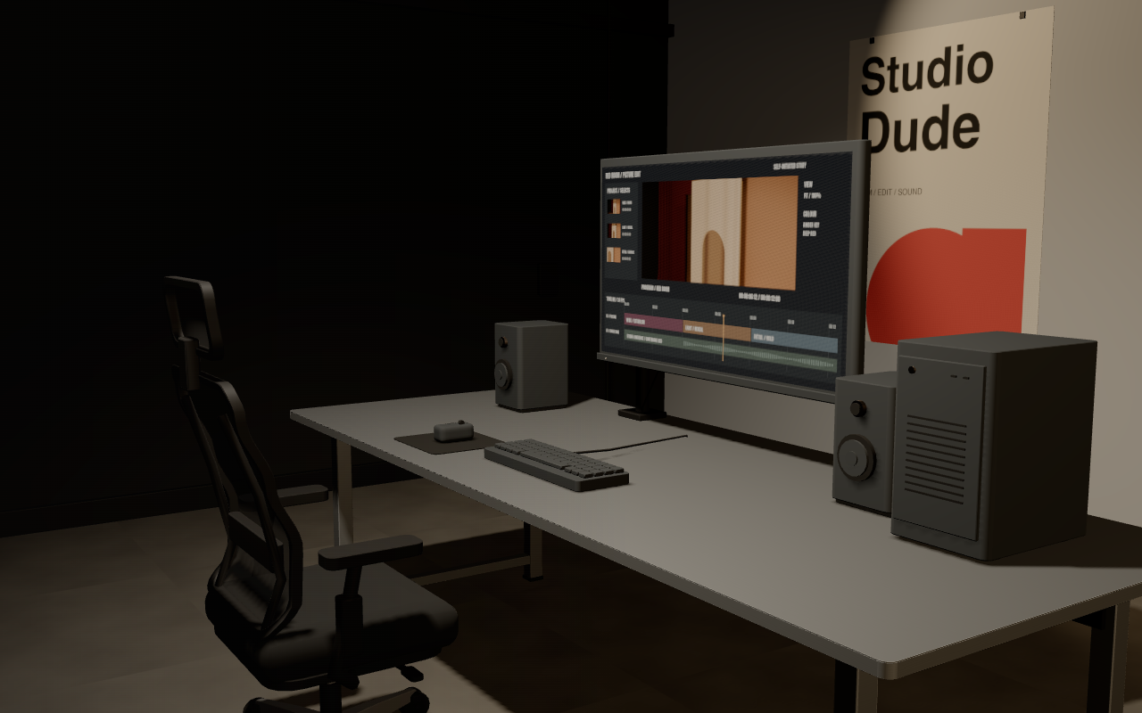 A stainless-steel editing desk with a large monitor, black mesh chair, keyboard, speakers and a Studio Dude poster.