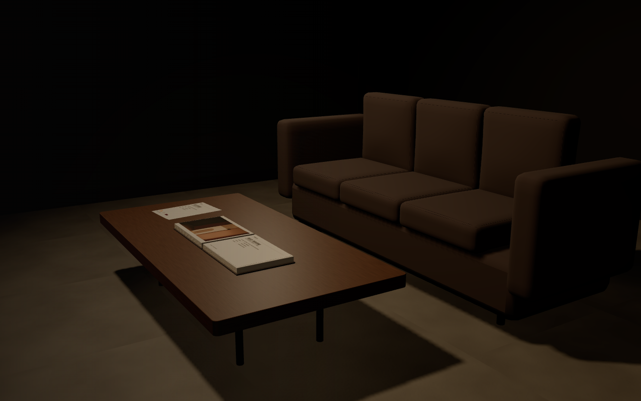 An open RED ROOM portfolio and marked proof prints on a meeting table in the warm lounge.