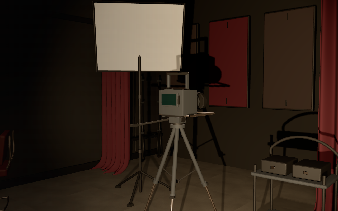 A fixed shooting room with a softbox on a stand, a tripod camera, equipment wagon, acoustic panels and stored light stands.